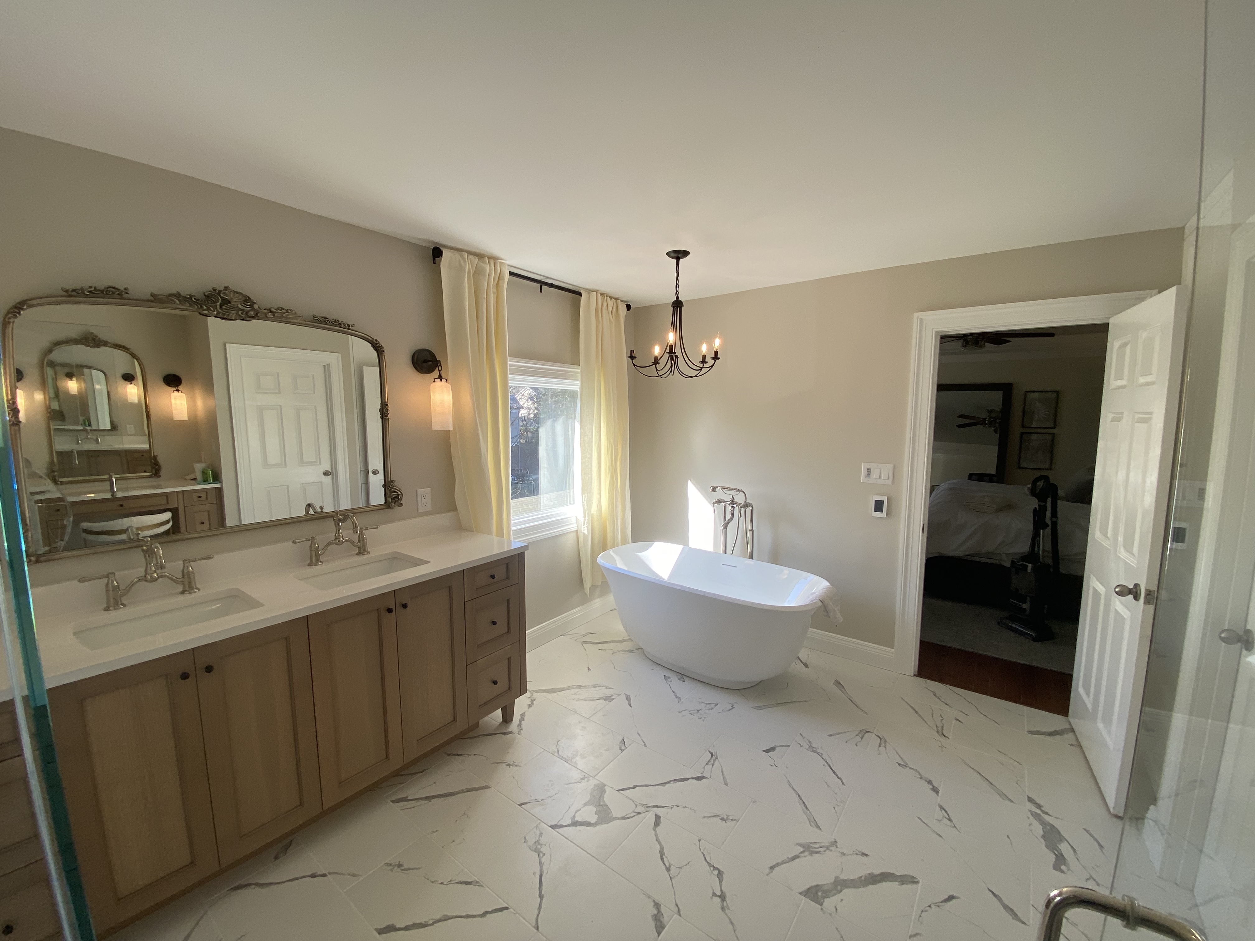 Rolling Hills bathroom — double vanity with quartz countertop and freestanding soaking tub by Luxe Built